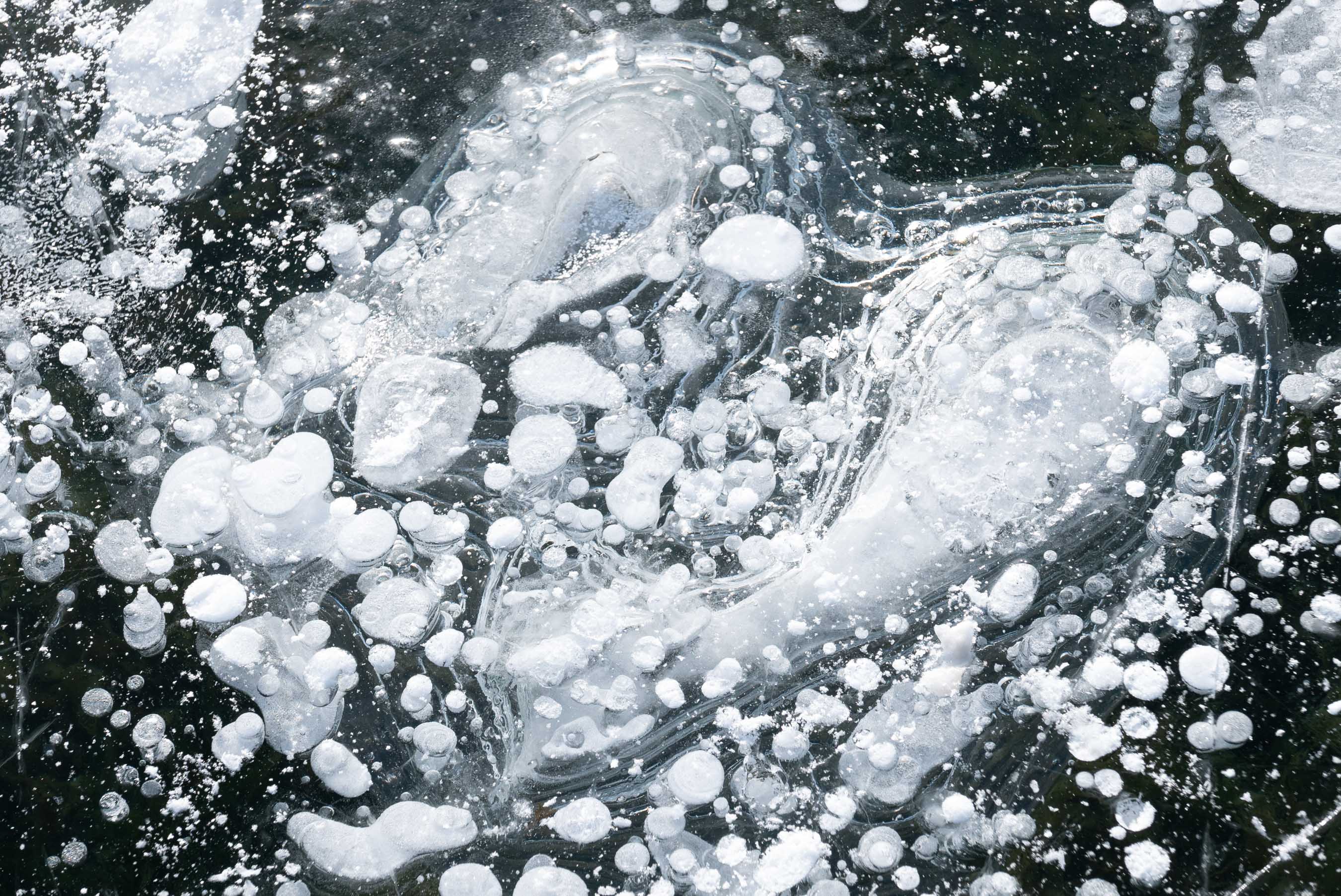 Ice and bubbles on Frozen lake Sils